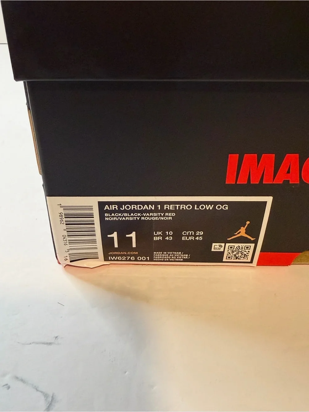 Jordan Low Top Sneaker in Black and Red